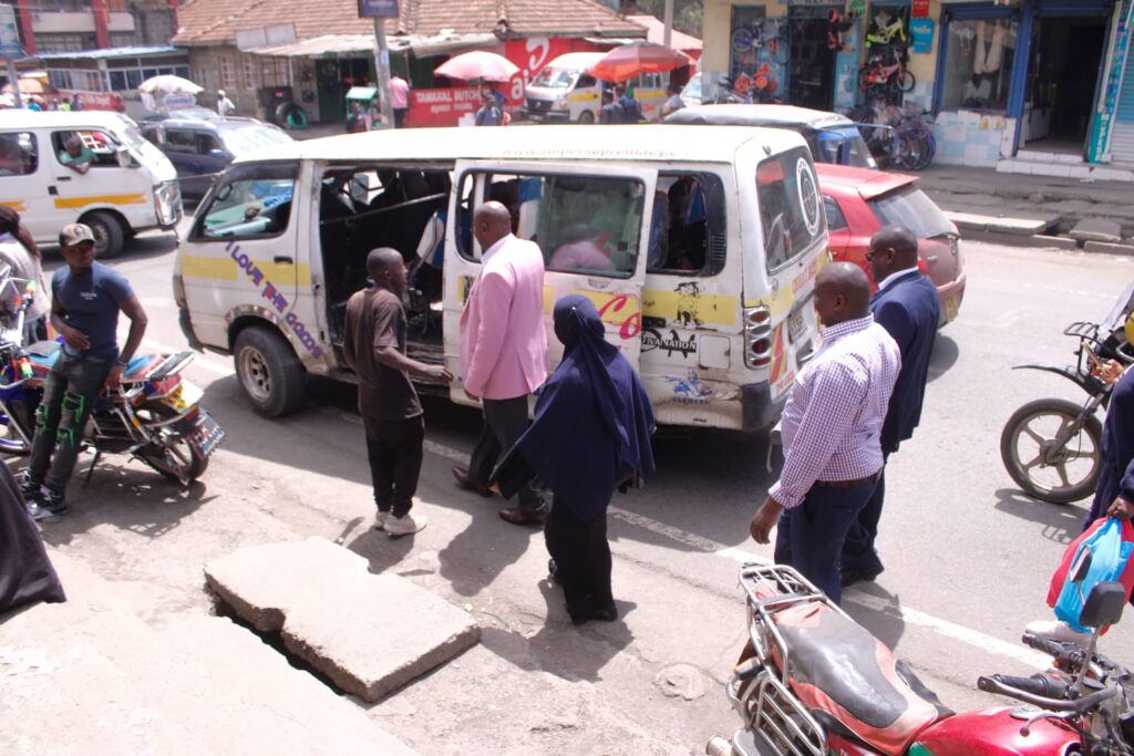 Muli and members walking towards Wakulima Market