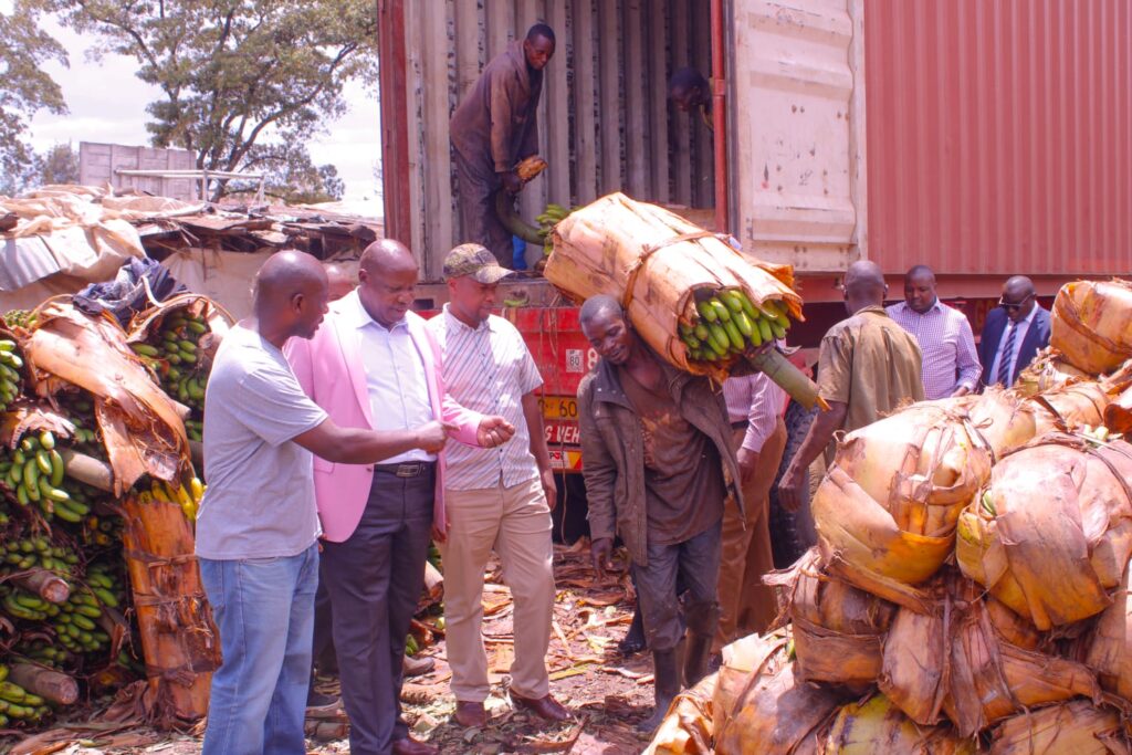 Stephen Muli with traders at Wakulima Market