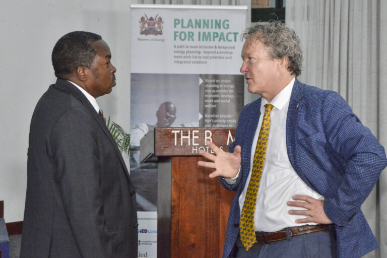 Engineer Isaac Kiva (left) and Mr Martin Andersen during the SETA closeout conference in Nairobi.